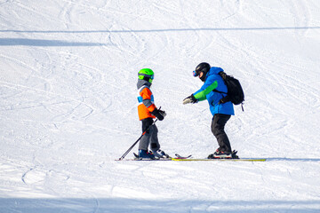 People are having fun in downhill skiing and snowboarding	