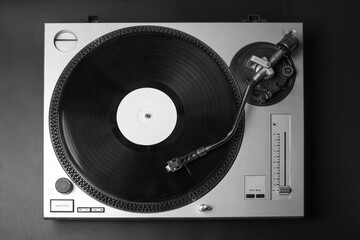 dj turntable vinyl  music player with disc isolated on black background