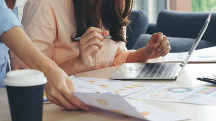 Two businesspeople meeting work at office desk. Teamwork partners team with Business strategy chart graph, infographic data financial report. Team partner planning marketing finance excel stat report