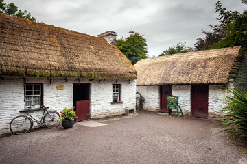 Fototapeta na wymiar Thatched roof cottages in a Traditional Irish village