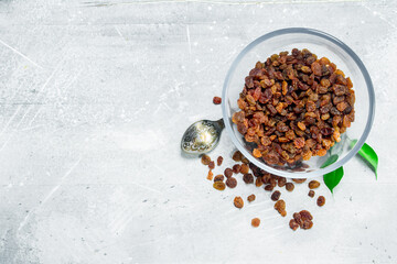 Raisins in a glass bowl.