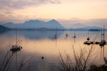Winter sunset panorama of the quiet waters of Maggiore Lake. Is the 2nd biggest lake in Italy...