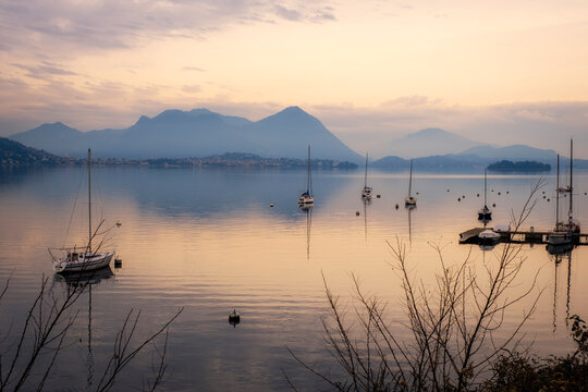 Winter sunset panorama of the quiet waters of Maggiore Lake. Is the 2nd biggest lake in Italy (after Garda) and it is divided between Italy and Switzerland territory.