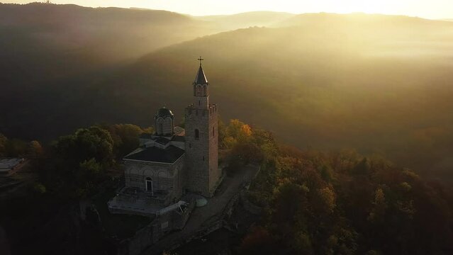 Dramatic Sunrise Sky Against Tsarevets Fortress During Autumn In Veliko Tarnovo, Bulgaria. Aerial Drone Shot