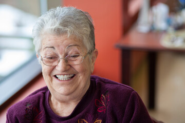 Close up portrait of elderly woman in retirement home.