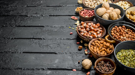 Assortment of different nuts in bowls.