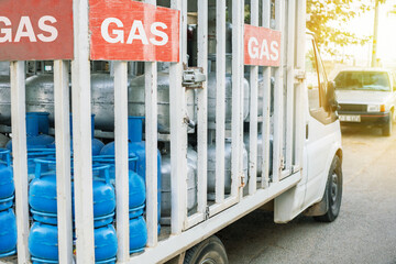 Truck with gas cylinders on the city road in Turkey. Truck delivered propane cylinders.