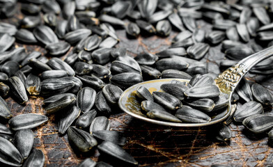 Sunflower seeds with a spoon.