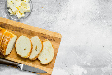 Breakfast. Fresh bread and butter on a wooden Board.