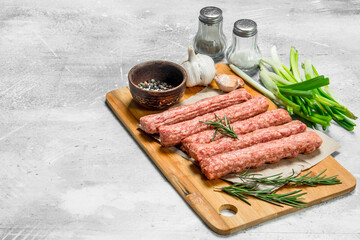 Raw beef sausages with garlic and herbs.