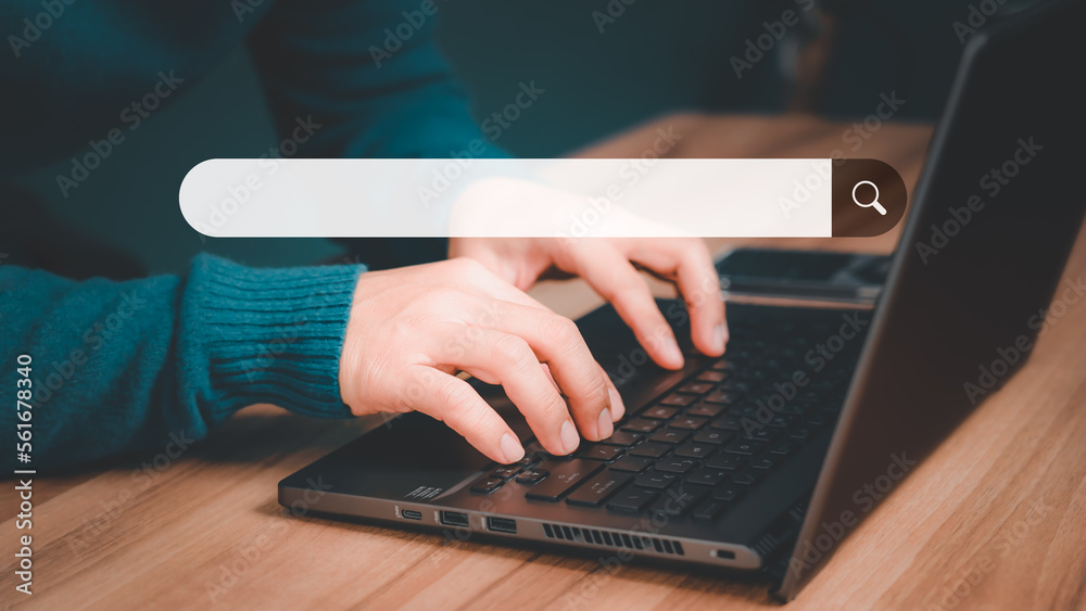 Poster Mature man hand working with laptop computer on table in his home. Search the Internet with an empty search bar. Best SEO search networking, Searching browsing internet data information concept.