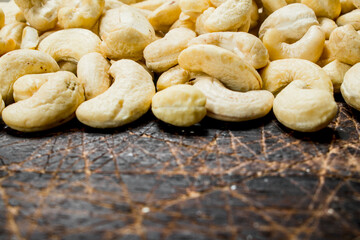 Cashew. On a wooden background.