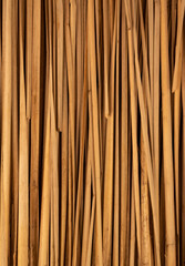 Rustic Charm: Perfectly Aligned Straw Bales on al Wooden Background