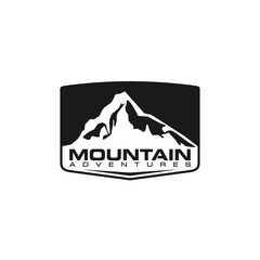 Simple mountain badge logo design