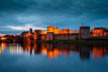 Reflection of King John's Castle at dusk in Limerick city, Ireland