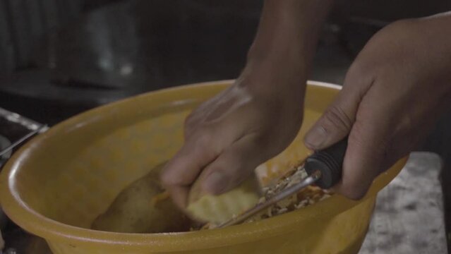 person preparing food in kitchen