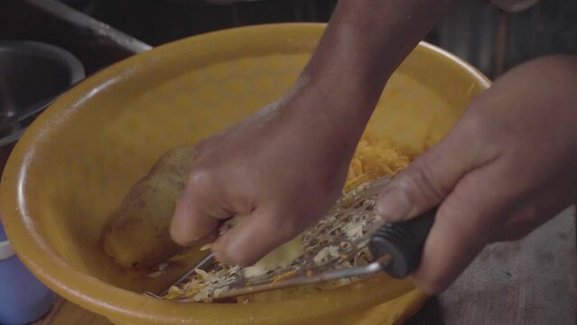 hands of cooking made potato