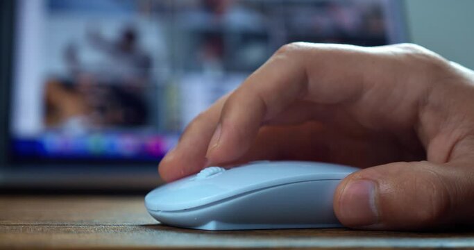 Close up using white computer mouse, scroll the mouse roller, surfing the net, Internet web pages. Working at laptop computer using mice, macro shot.