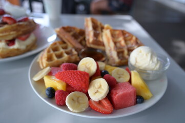 A lot of fruits on the waffle
