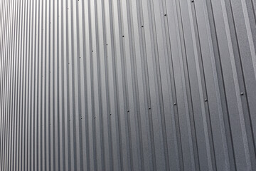 gray corrugated metal sheet background. industrial building wall.