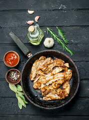 Fried bacon with tomato sauce.