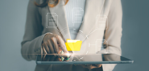 Business, technology, internet and networking concept. Asian businesswoman exploring virtual reality with VR headset select folder icon on the virtual display.