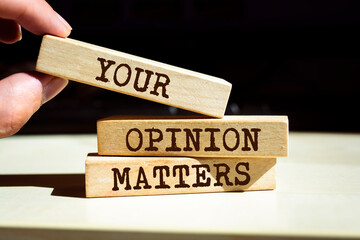 Wooden blocks with words 'Your Opinion Matters'.