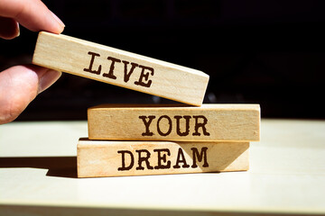 Wooden blocks with words 'Live your dream'.