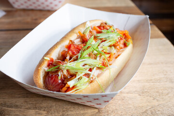 A view of a kimchi hot dog.