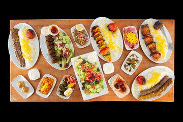 A top down view of several Persian entrees on a table.