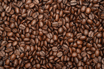 A pile of freshly roasted coffee beans. top view