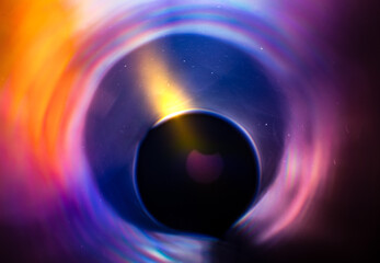 An artistic representation of a partial solar eclipse in beautiful, grainy, colorful manner.