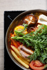 A top down view of a Taiwanese hot pot entree.