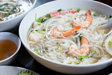 A view of a bowl of seafood pho. © DAVID