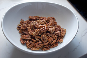A view of a bowl of pecans.