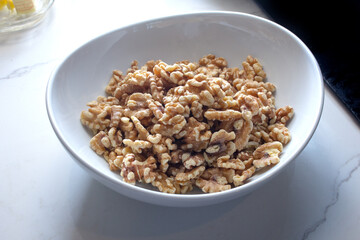 A view of a bowl of walnuts.
