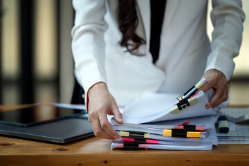 Business Documents concept, woman hands working on Stacks paper files for checking document...