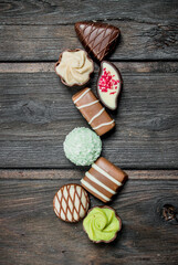Fototapeta premium Chocolate sweets with nuts and various fillings.