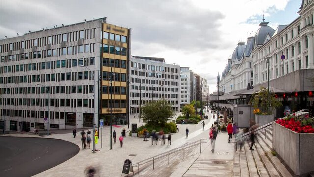 Busy flow blurred crowd in central Oslo walking street during daytime