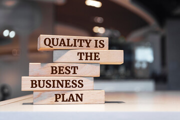 Wooden blocks with words 'Quality is the best business plan'.