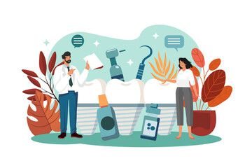 stomatologist doctor explains proper dental hygiene to the patient holding the sample.