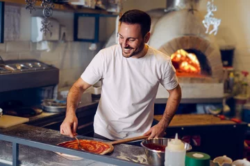 Deurstickers Pizza chef working in the kitchen © zorandim75