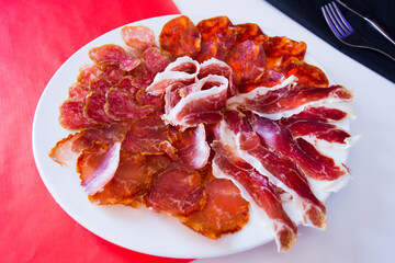 Table of Iberian sausages such as ham, salchichón, lomo and other Spanish delicatessen.