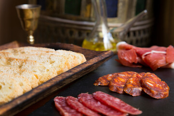 Table of Iberian sausages such as ham, salchichón, lomo and other Spanish delicatessen.