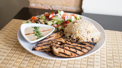 Free-range chicken cooked on the grill in an oven.