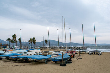 Fototapeta na wymiar Port Cogolin boats on the seaside shore rainy day