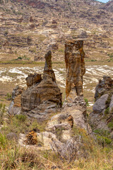 Rock formation in Isalo National Park in Ihorombe Region. Wilderness landscape with water erosion into rocky outcrops like in Utah, plateaus, extensive plains and deep canyons. Madagascar landscape.