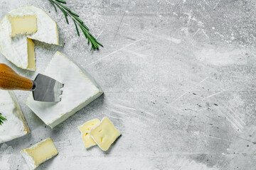 Brie cheese with knife.