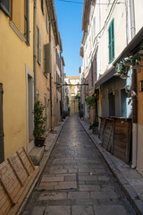 Fototapeta na wymiar Saint Trope narrow street with plants