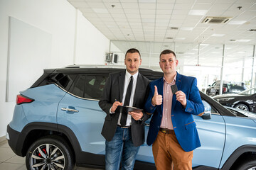 salesperson in car dealership buyer show thumbs up as sign of satisfaction with purchase car